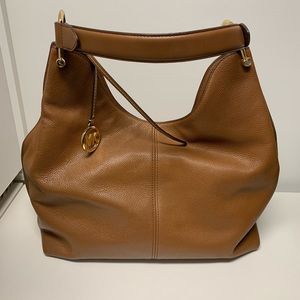 Michael Kors large purse with divider pockets included. Brand new condition.
